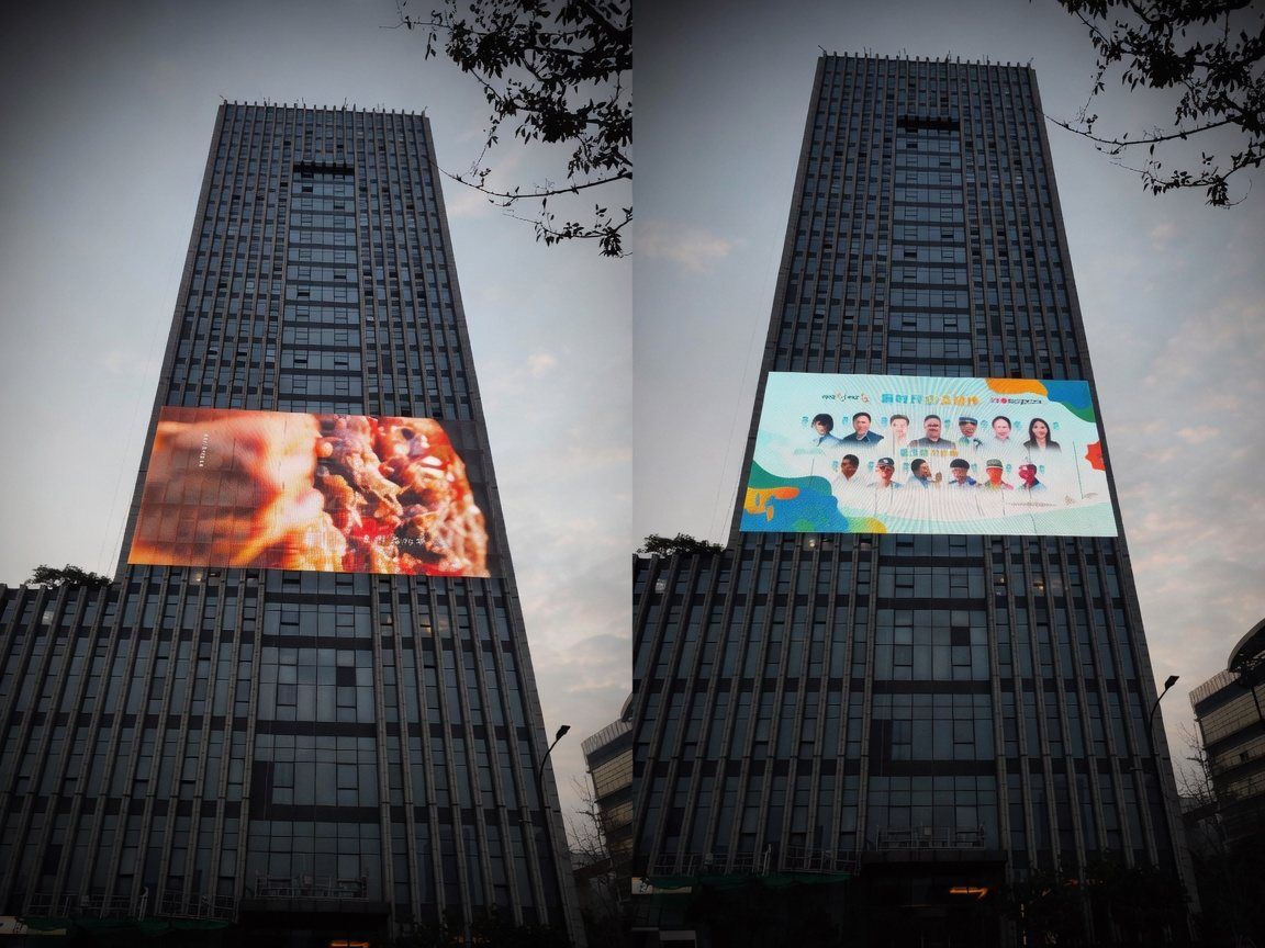 High-rise towers with large-format LED mesh film on the glass facades